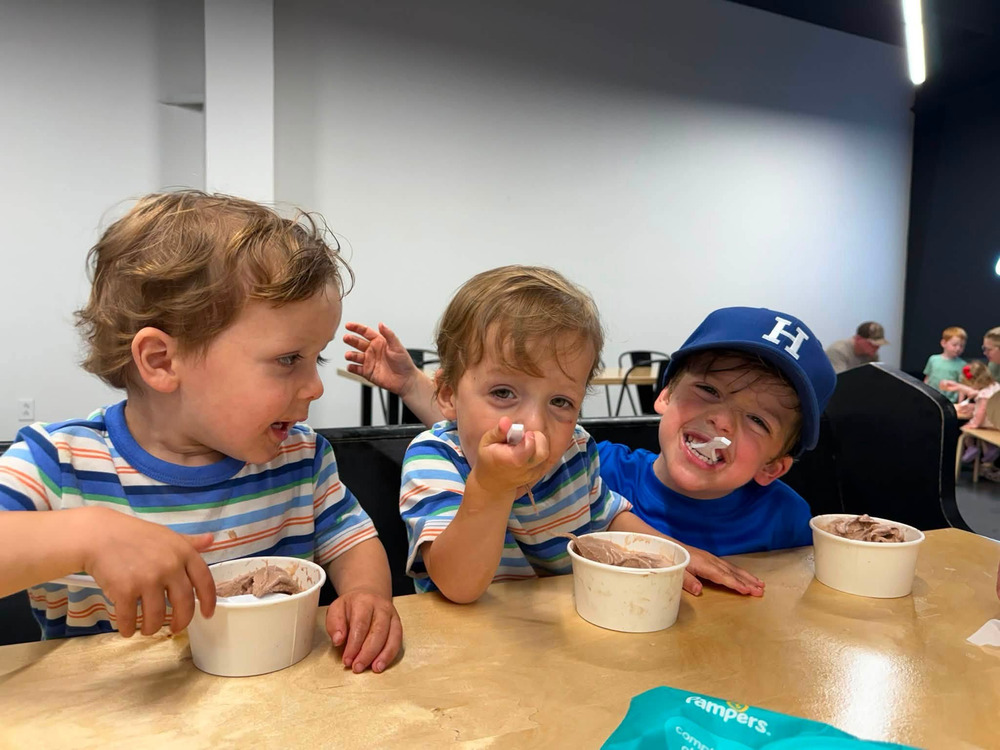 Carter back home with his brothers, the three of them eating ice cream together